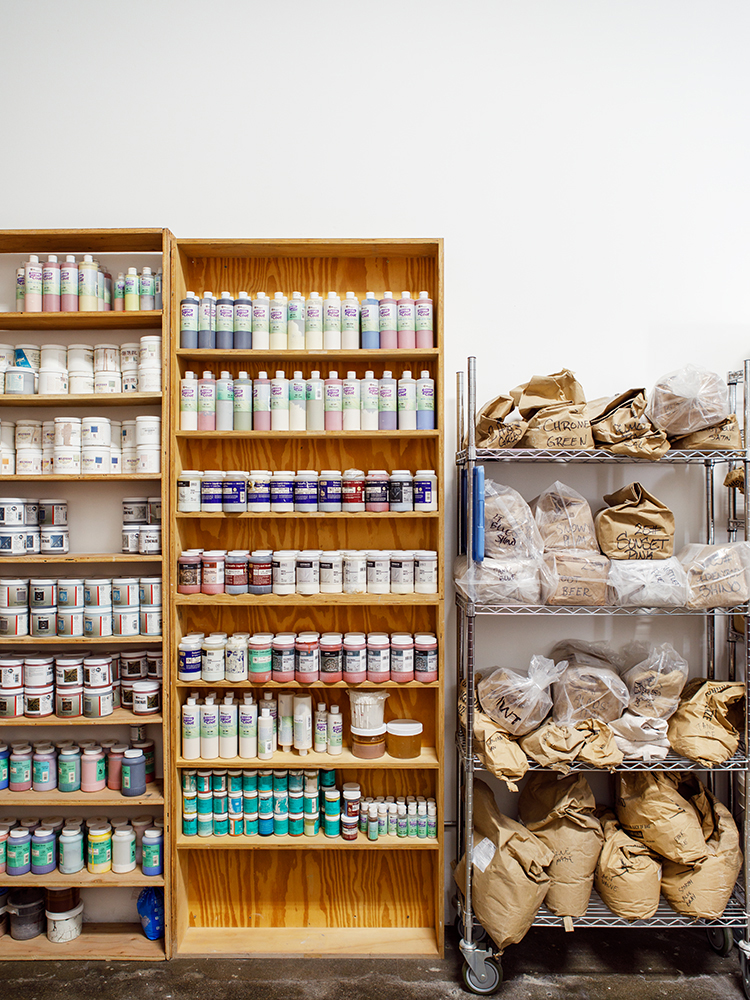 Shelves filled with colored glazes