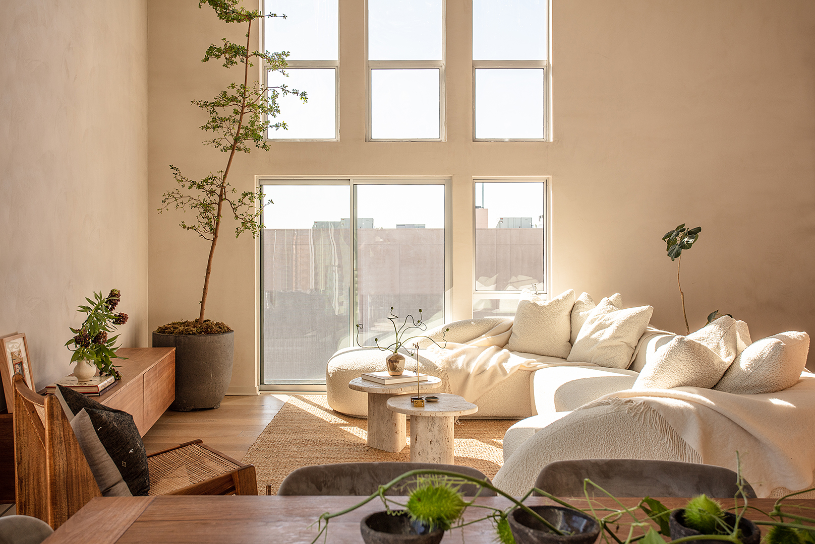 living room with large windows and boucle sectional