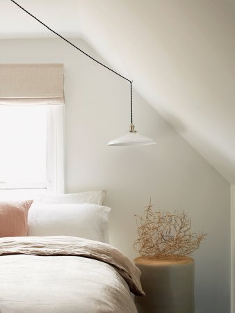 Bedroom with white paint and white bed linens