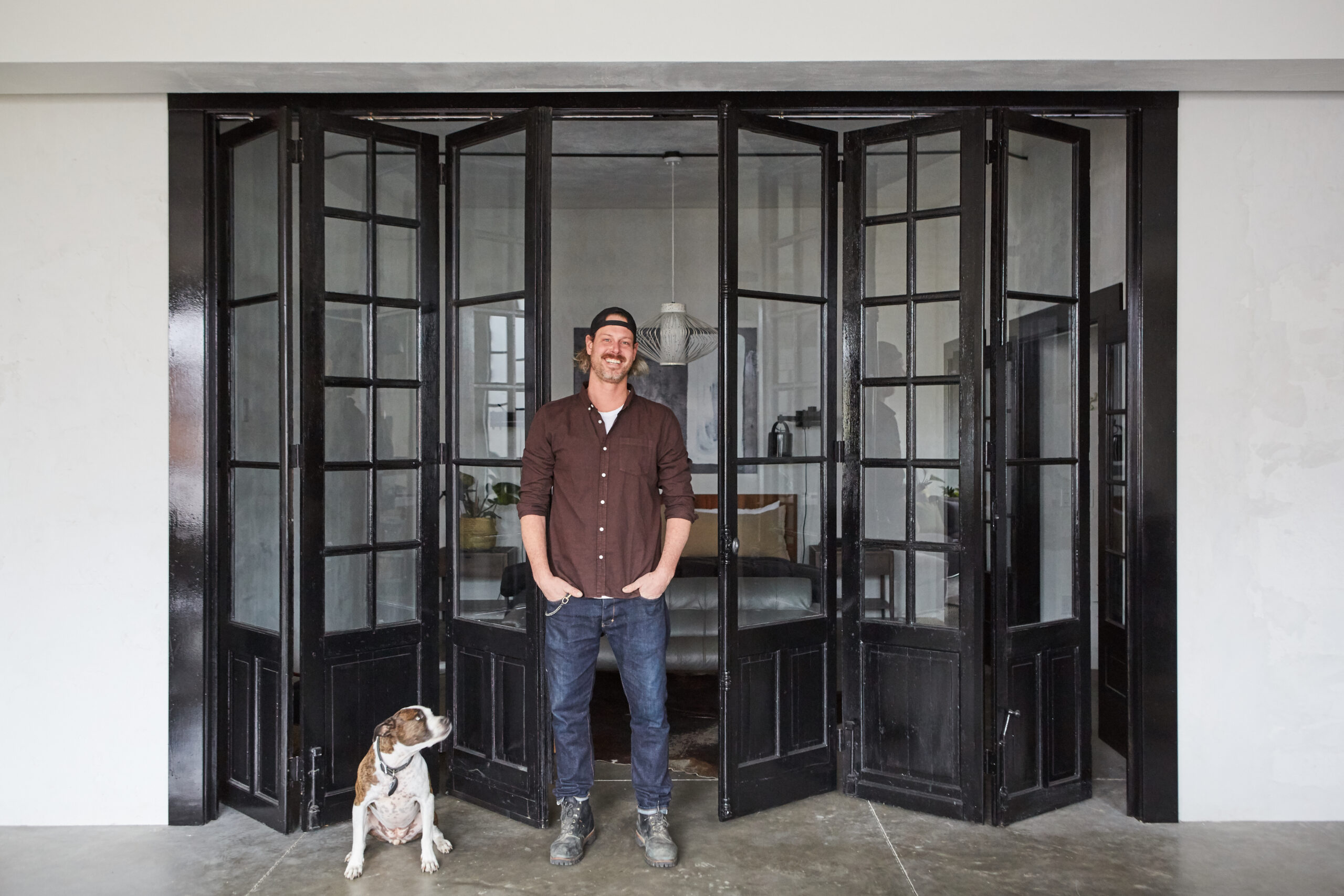 man in front of glass windows