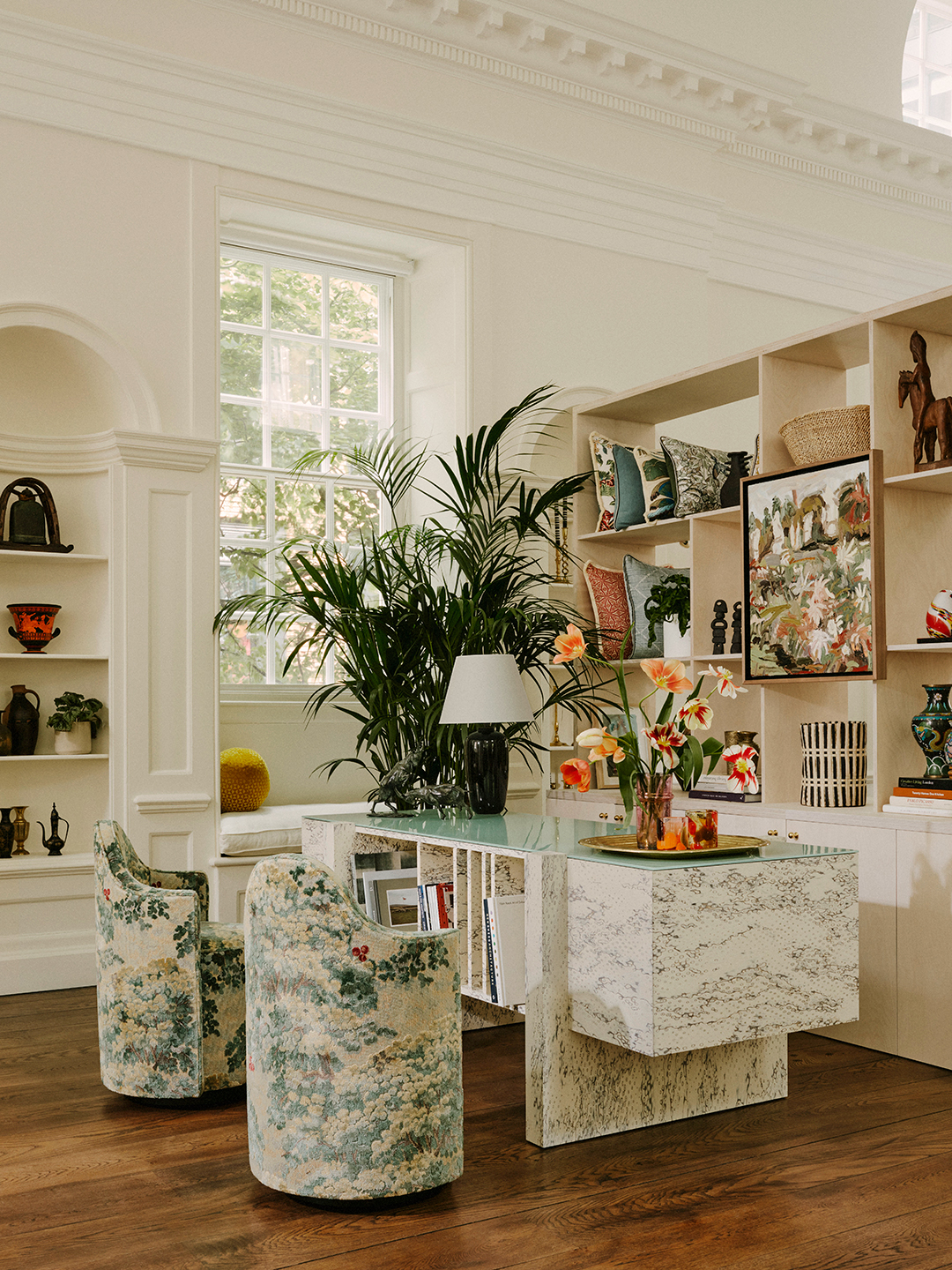 office space with stone desk and swivel armchairs