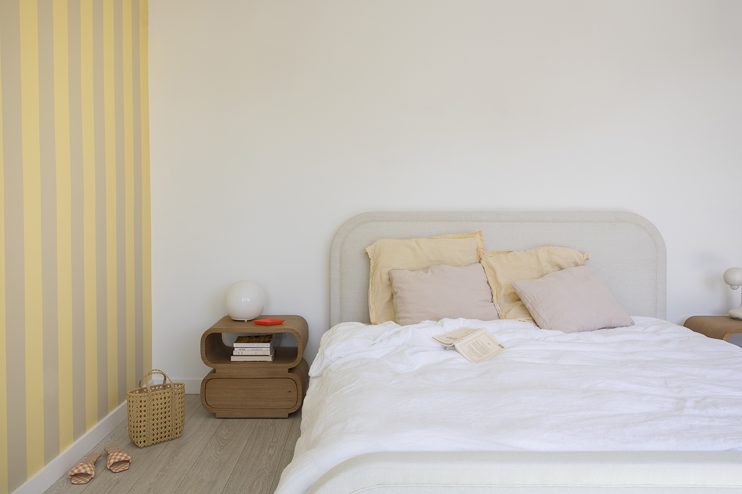 primary bedroom with gray and yellow striped wall