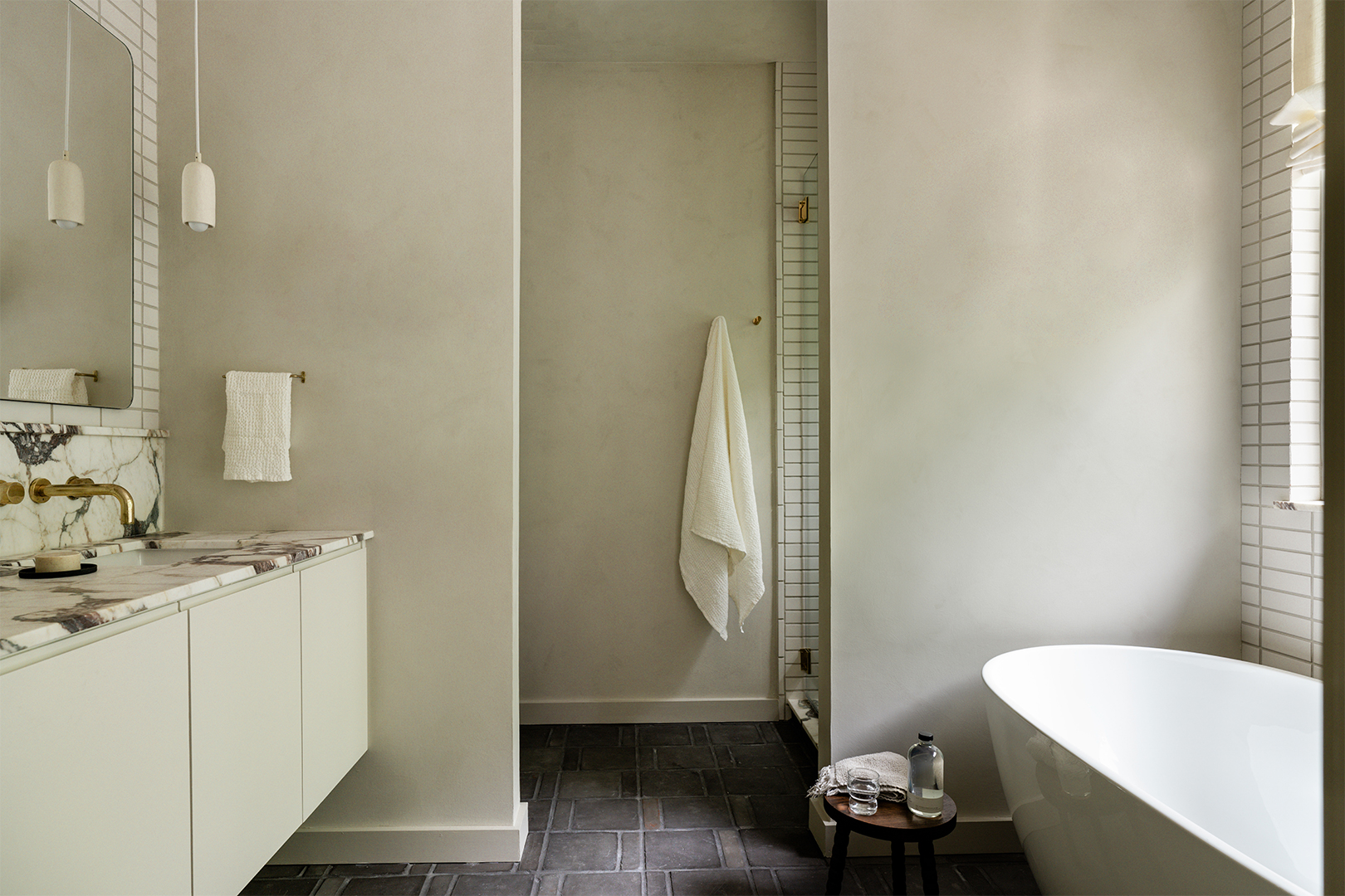 tub across from bathroom vanity