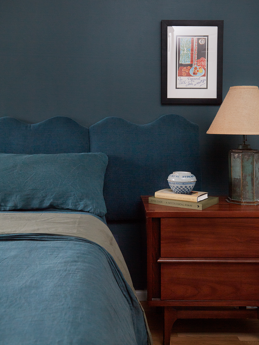 teal bedroom with teal bed and bedding