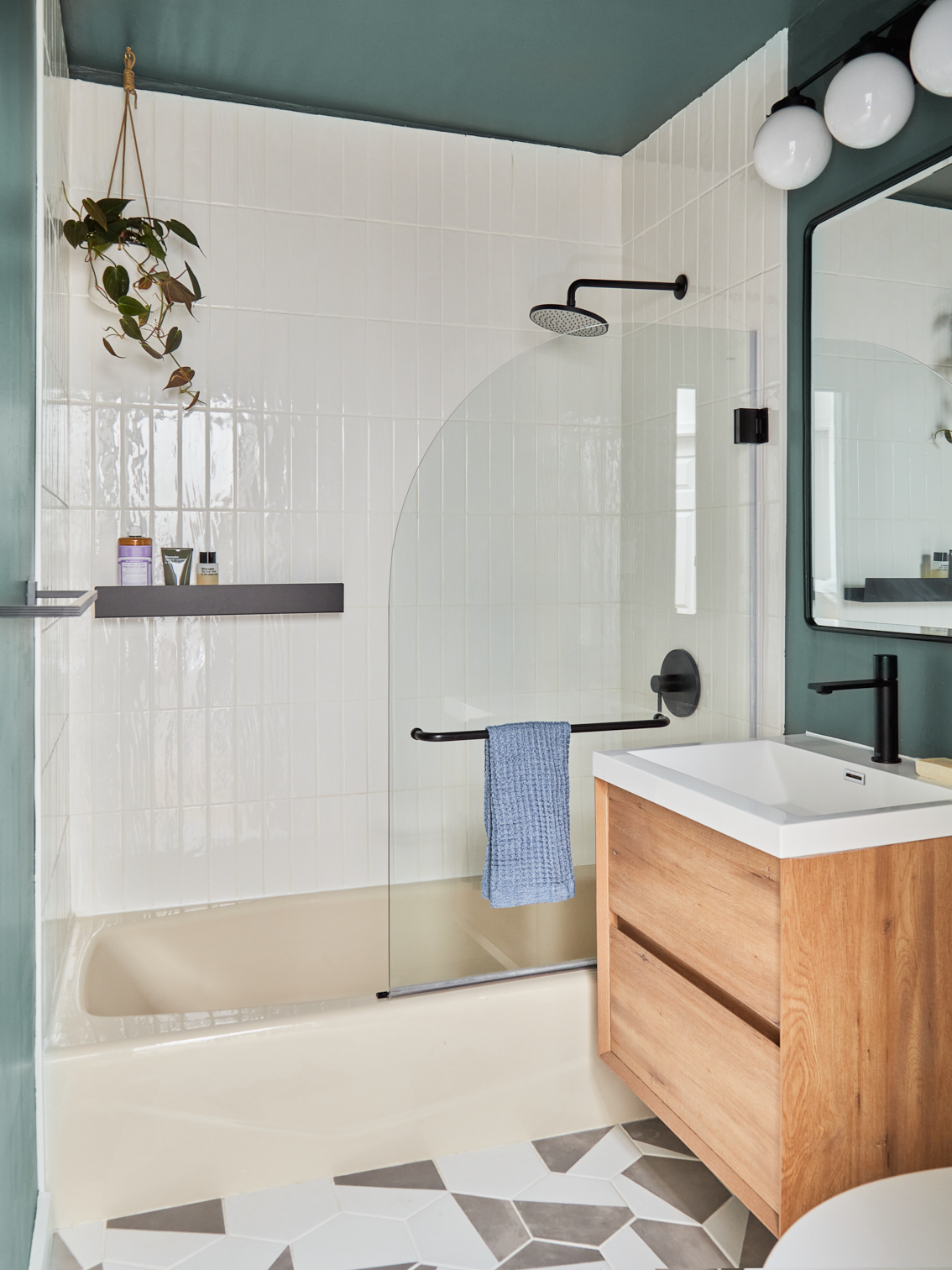 wood vanity and sleek shower