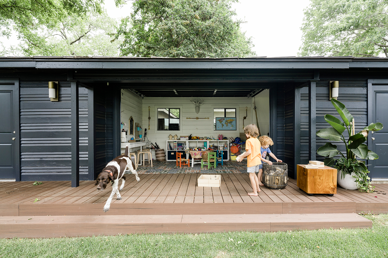 boys running around on playroom deck