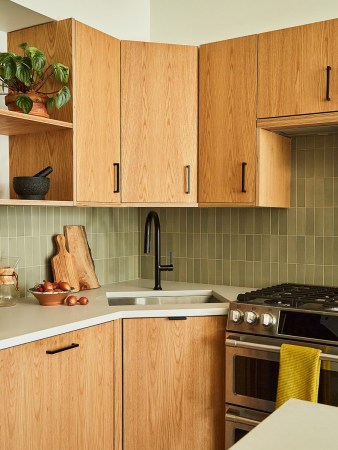 kitchen with wood cabinets and black hardware