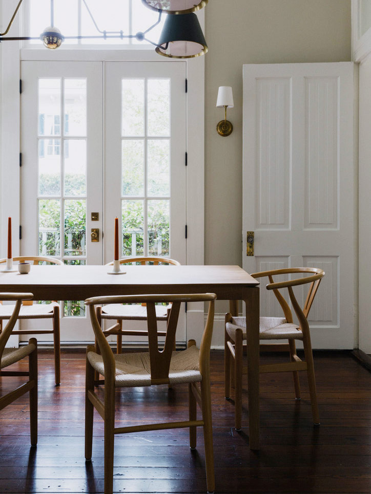 dining room with wishbone armchairs