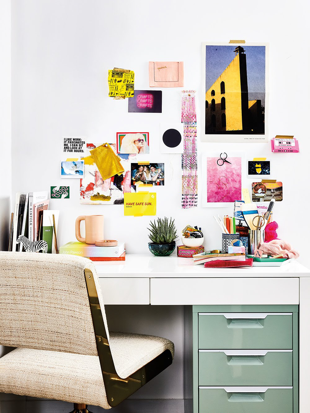 desk set up with green file cabinet