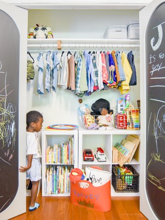 boy looking through his closet