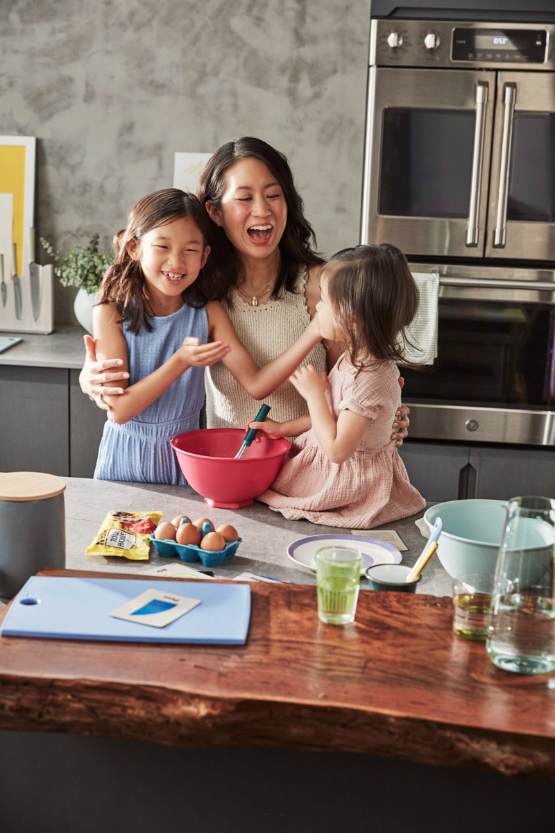 Mother and children baking in the kitchen.