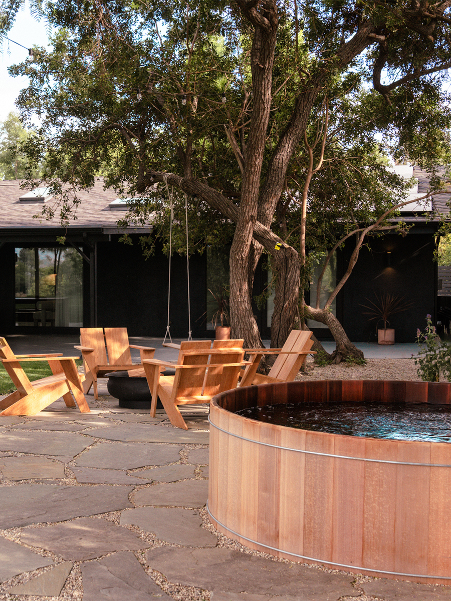 backyard with flagstone patio and sunken hot tub