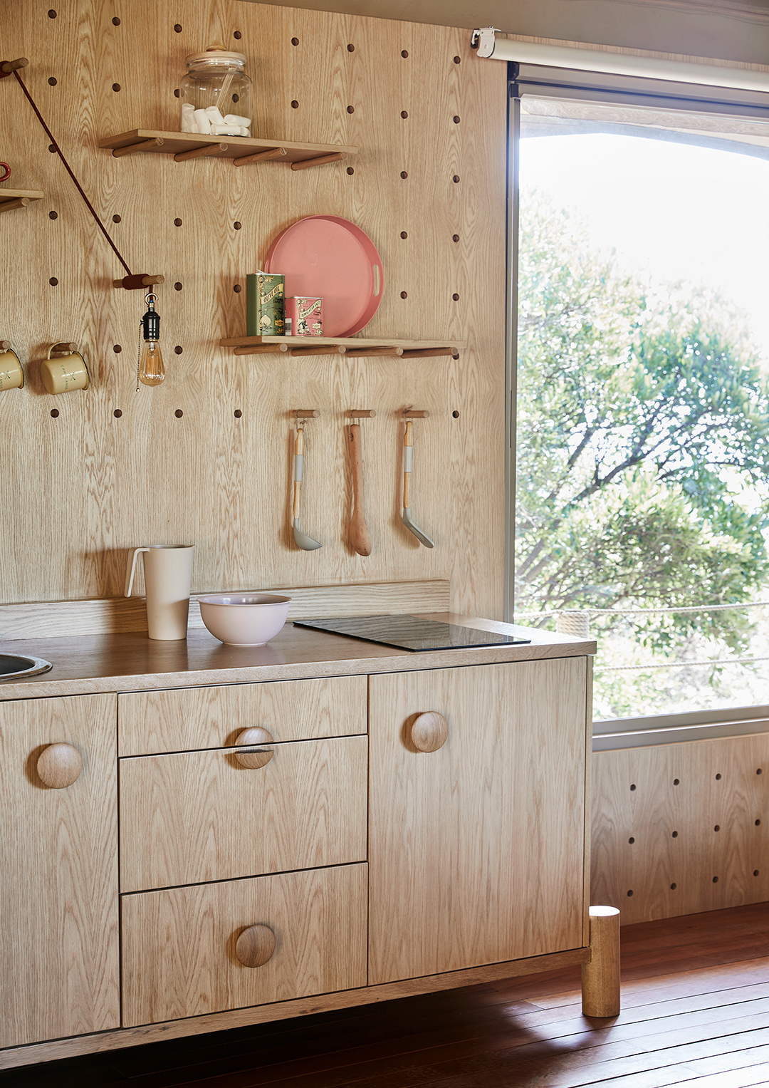 kitchen with plywood cabinetry and walls