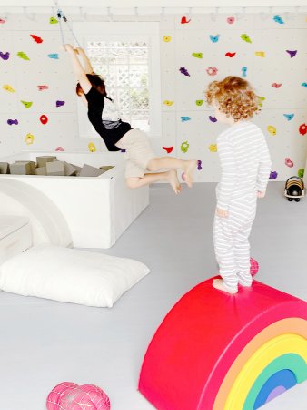 boy standing on foam rainbow