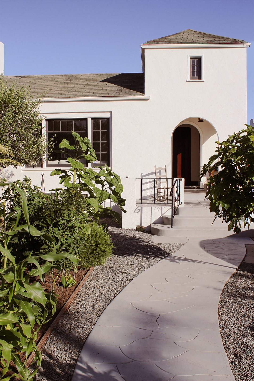 white house with gravel path