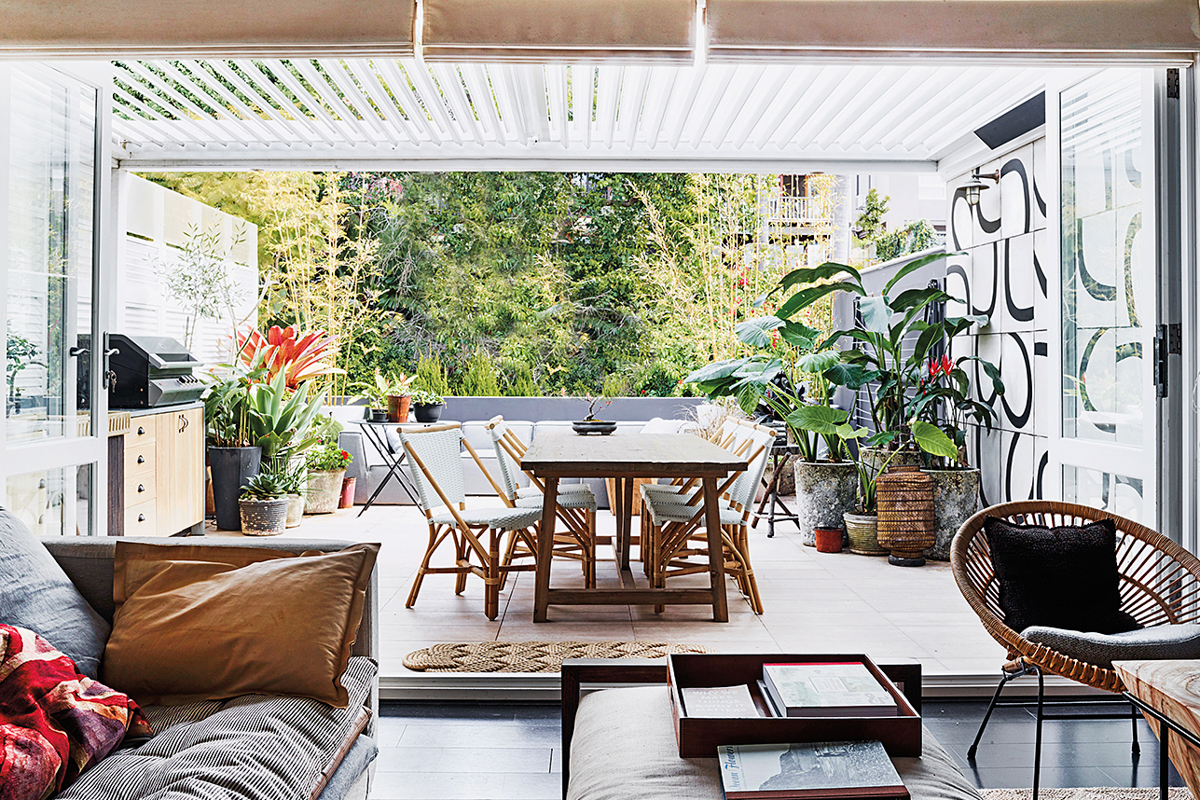 covered patio with tile flooring wooden dinette set