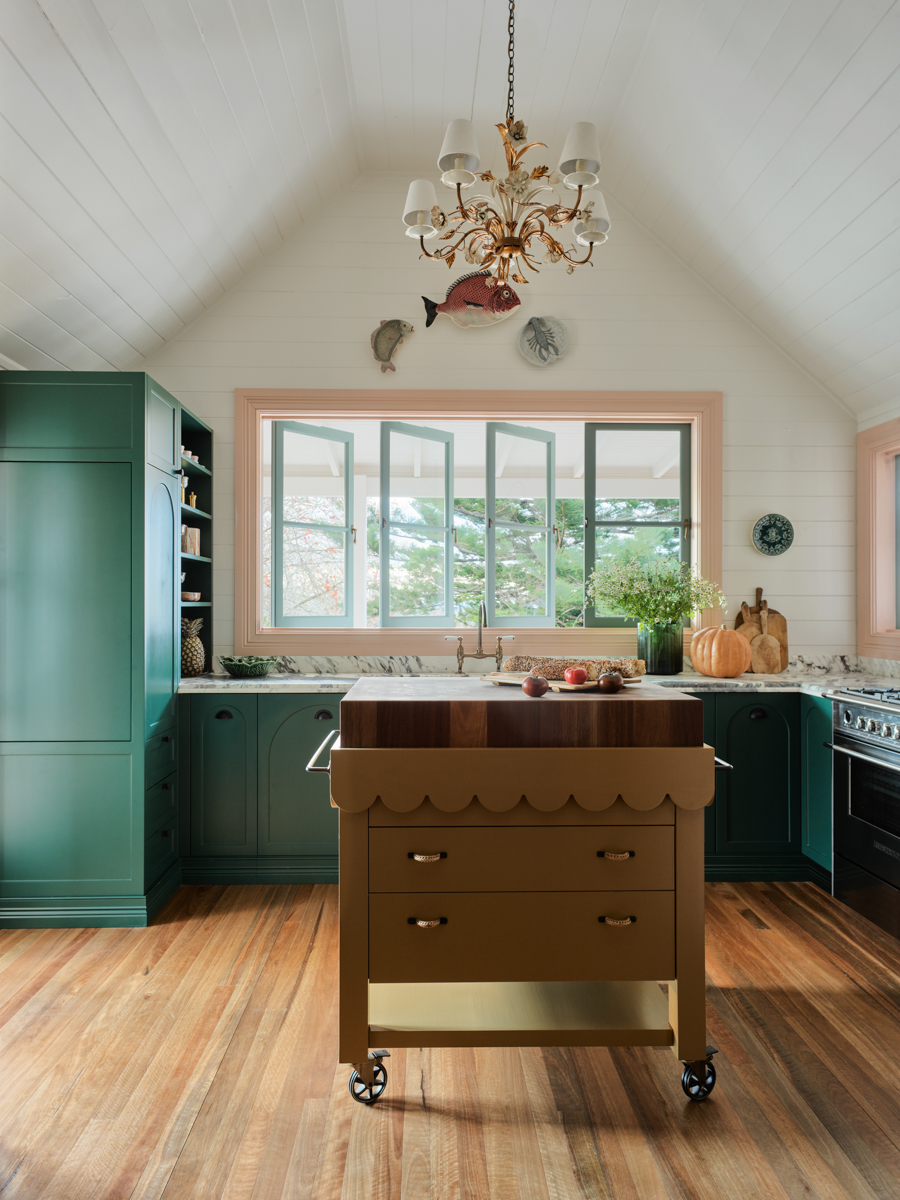 kitchen with yellow island and green cabinets