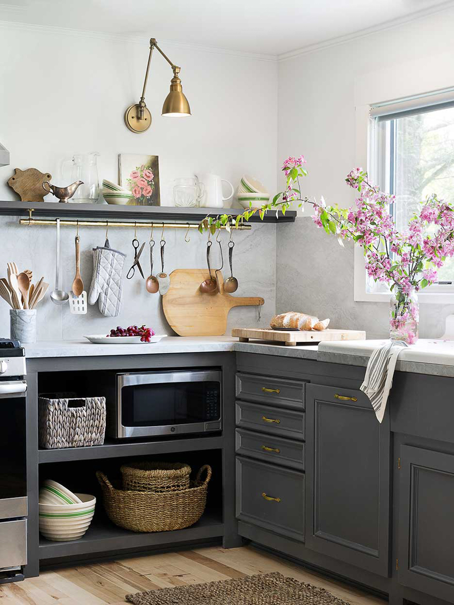 kitchen with grey cabinets and marble backsplash