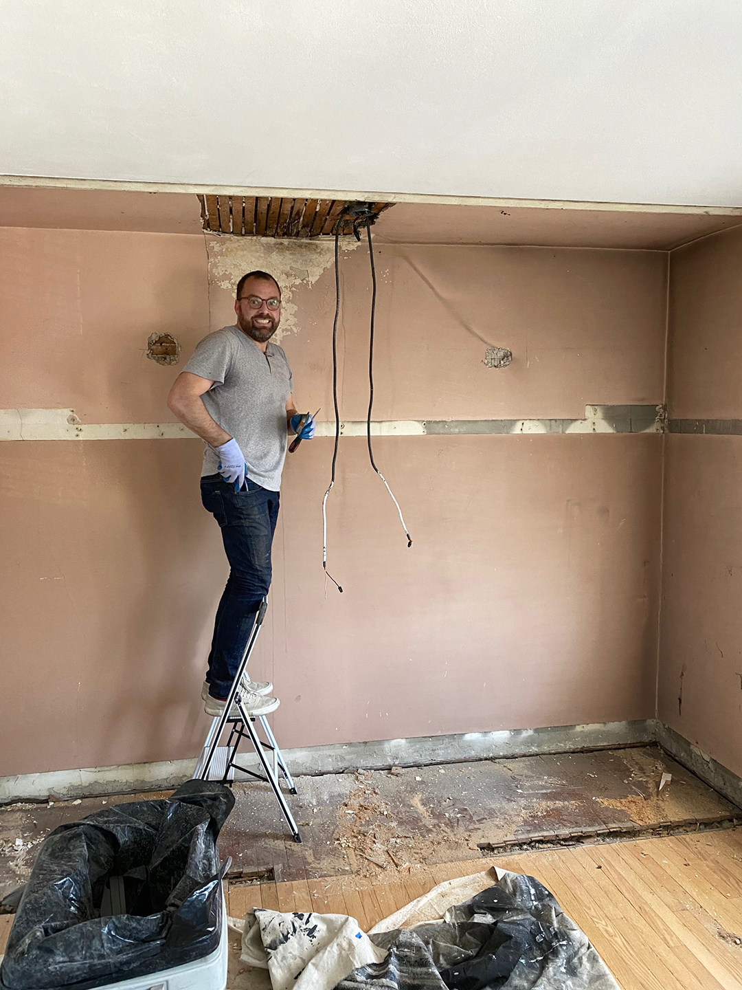 man standing on ladder