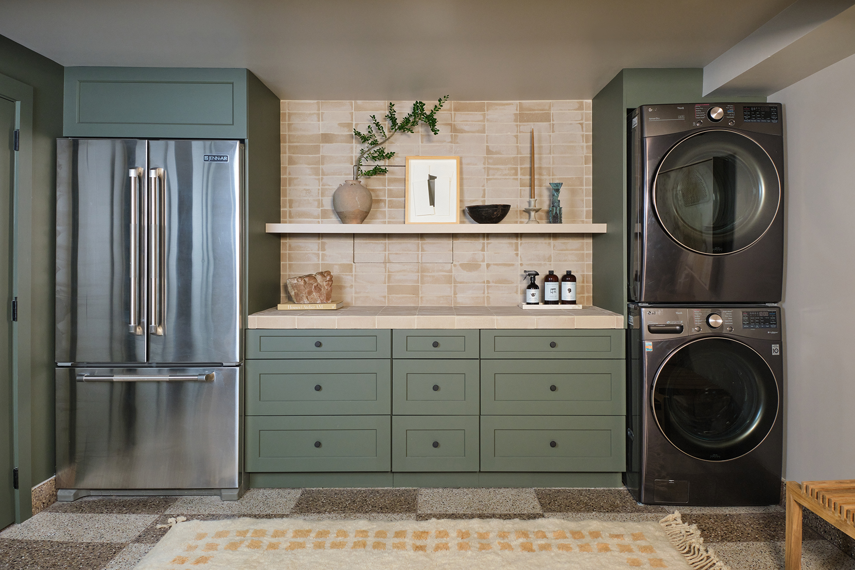 fridge and laundry machines in basement