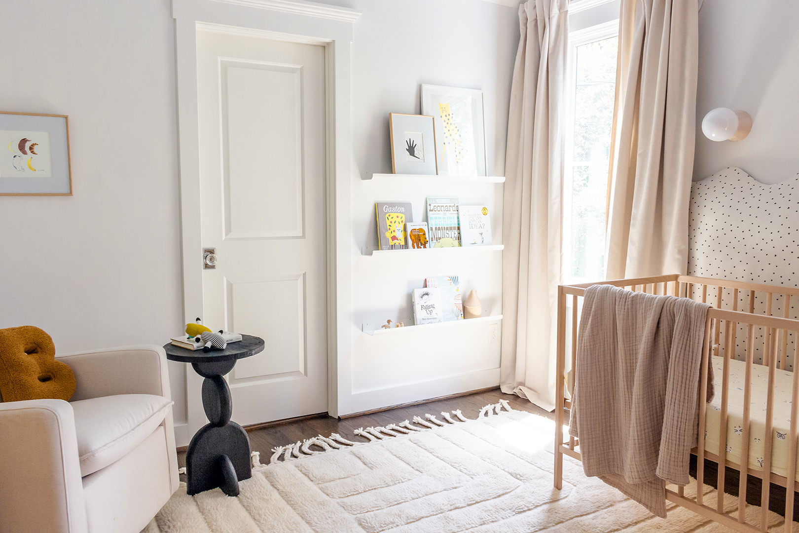 corner of minimalist white nursery