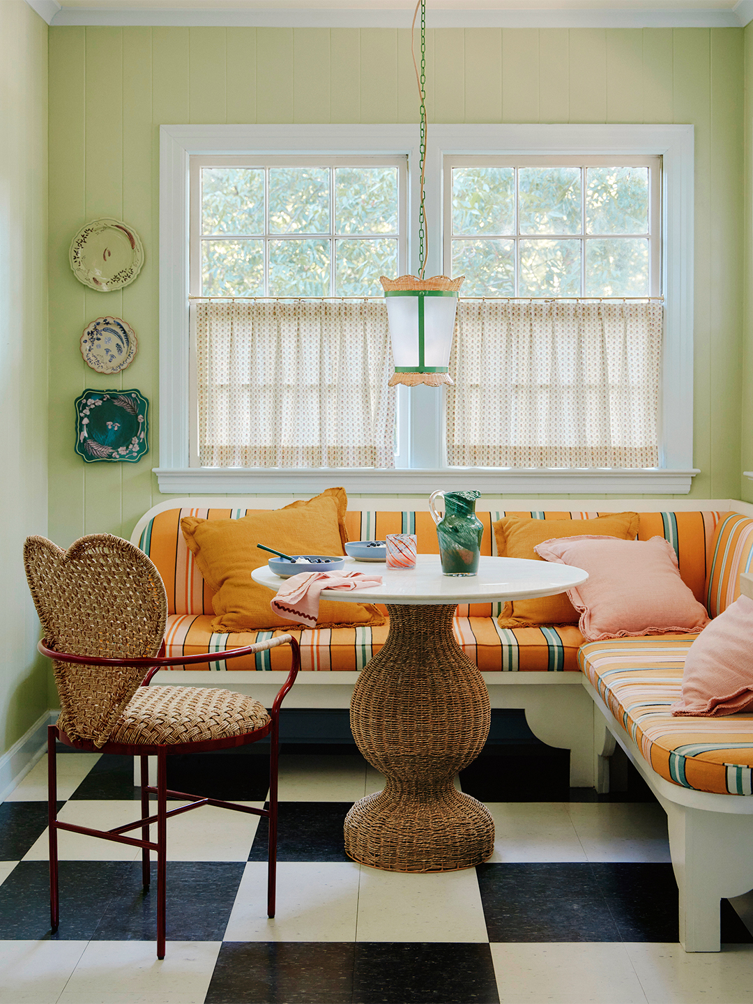 yellow corner breakfast nook with checkered floors