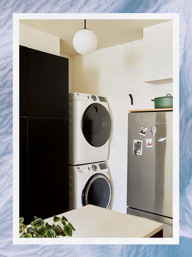 white stacked washer and dryer