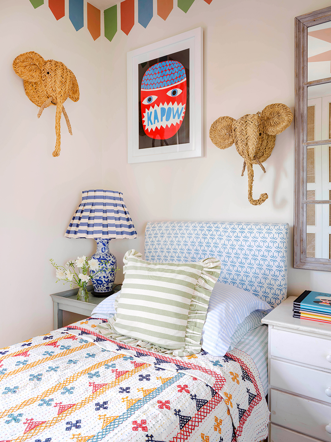 wicker elephants over bed in kid's room