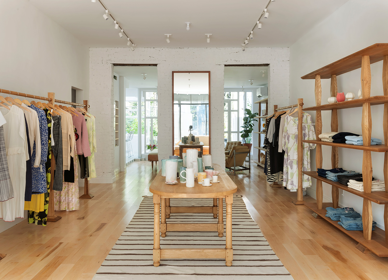 Store with wooden table with ceramics on it