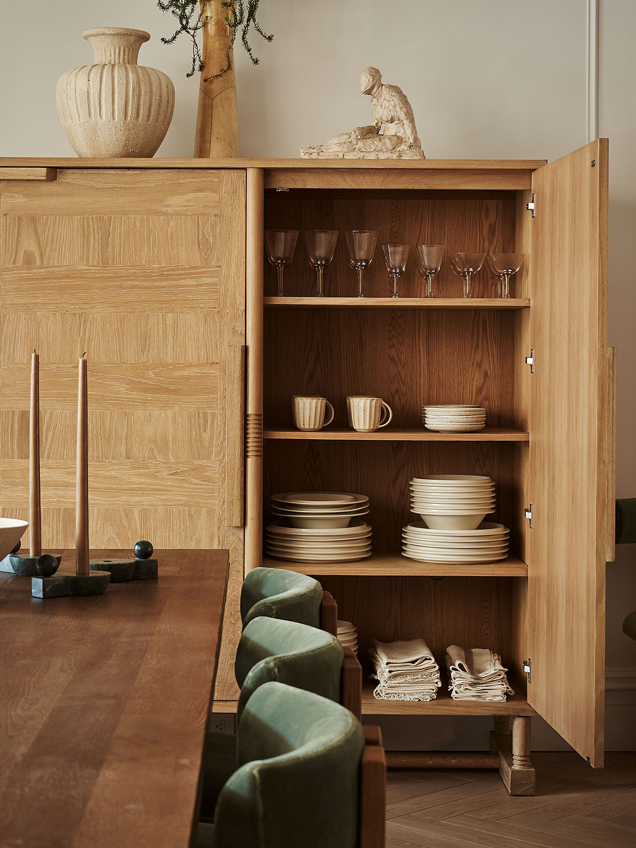 Open cabinet revealing dishware