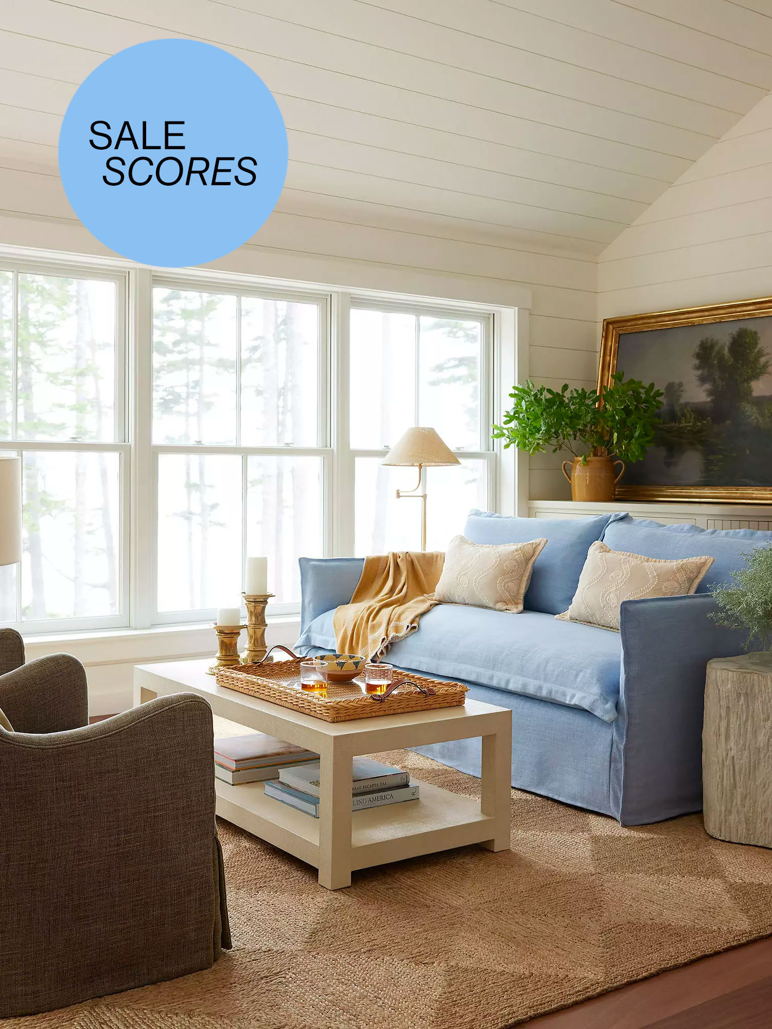 Blue sofa in a living room with a sticker that says "sale scores"