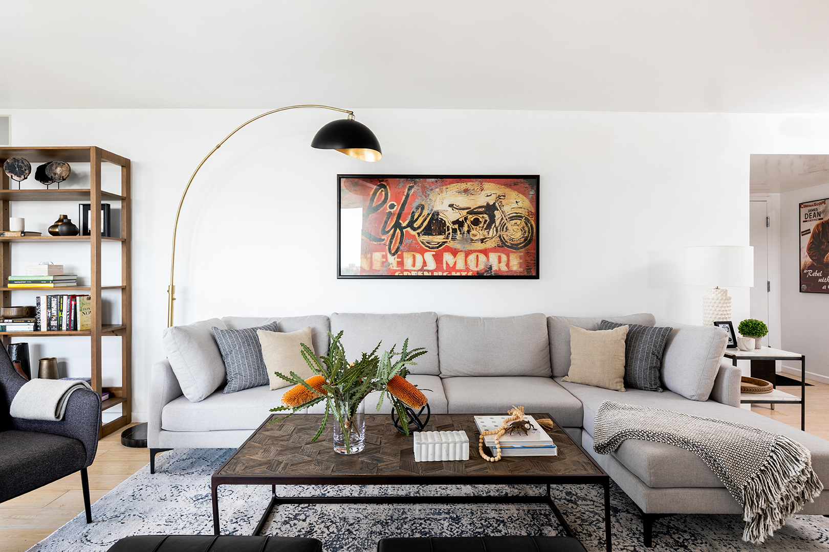 Living room with light grey sofa and round floor lamp