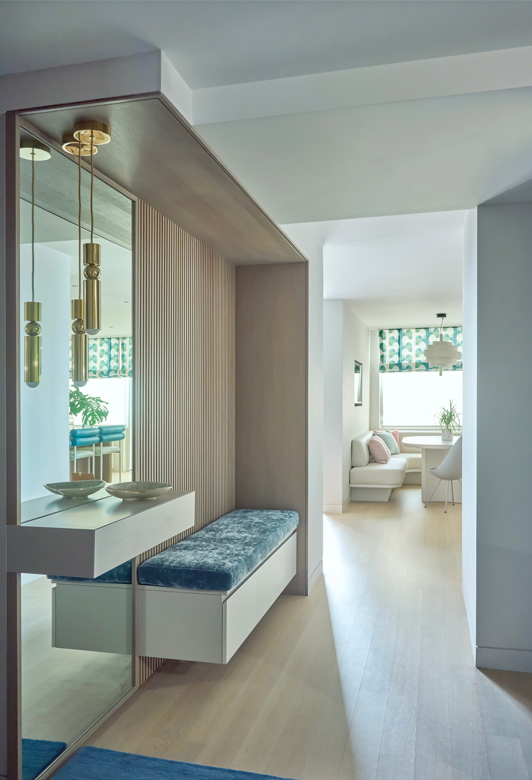 entry way with wood paneling and blue bench