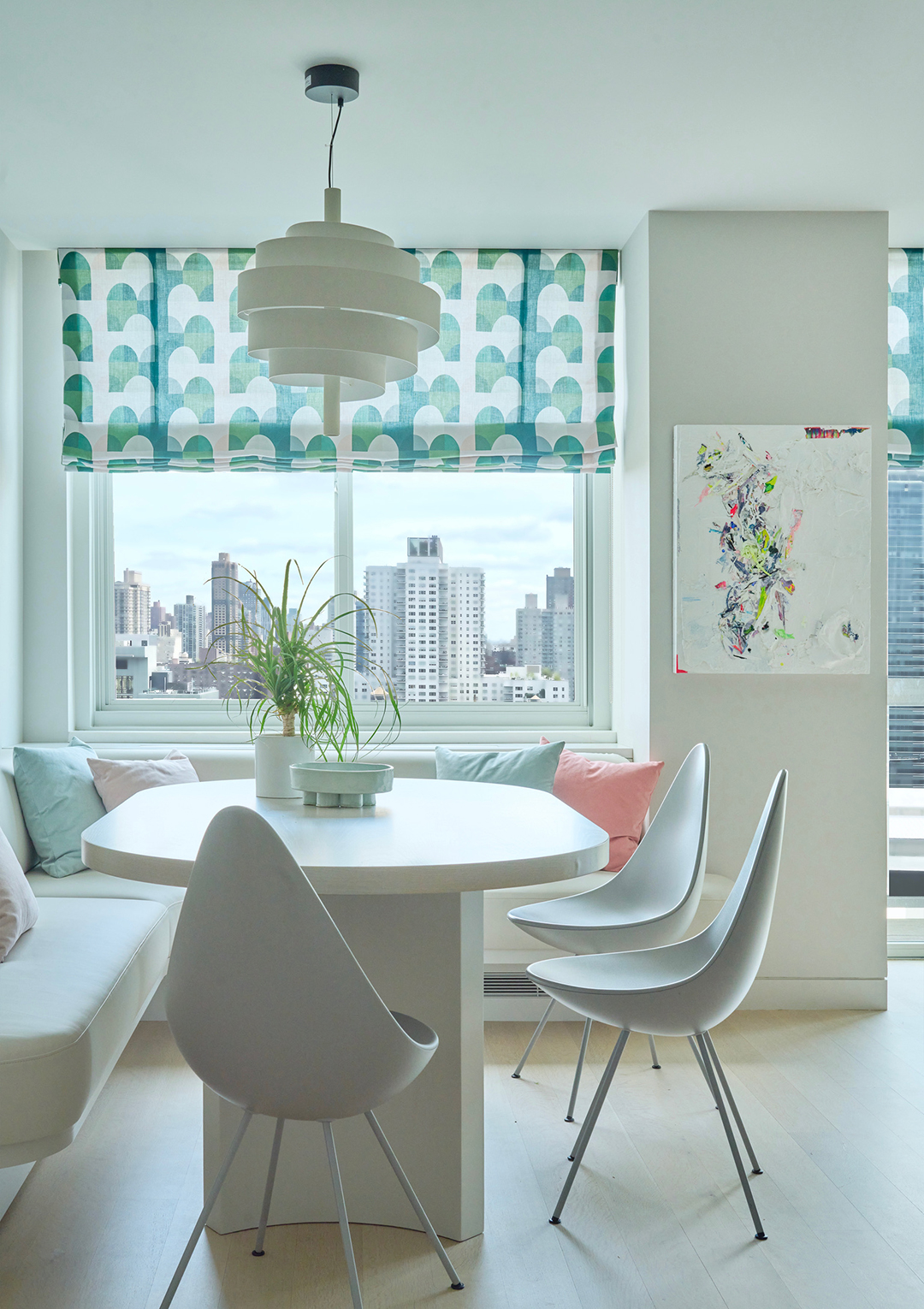 breakfast nook with white dining chairs