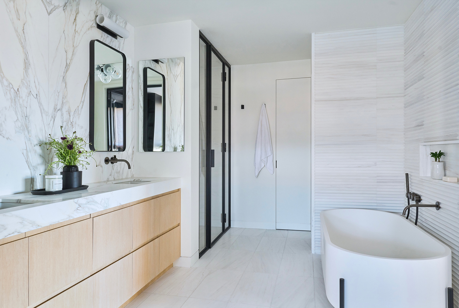 bathroom with marble tile on the walls