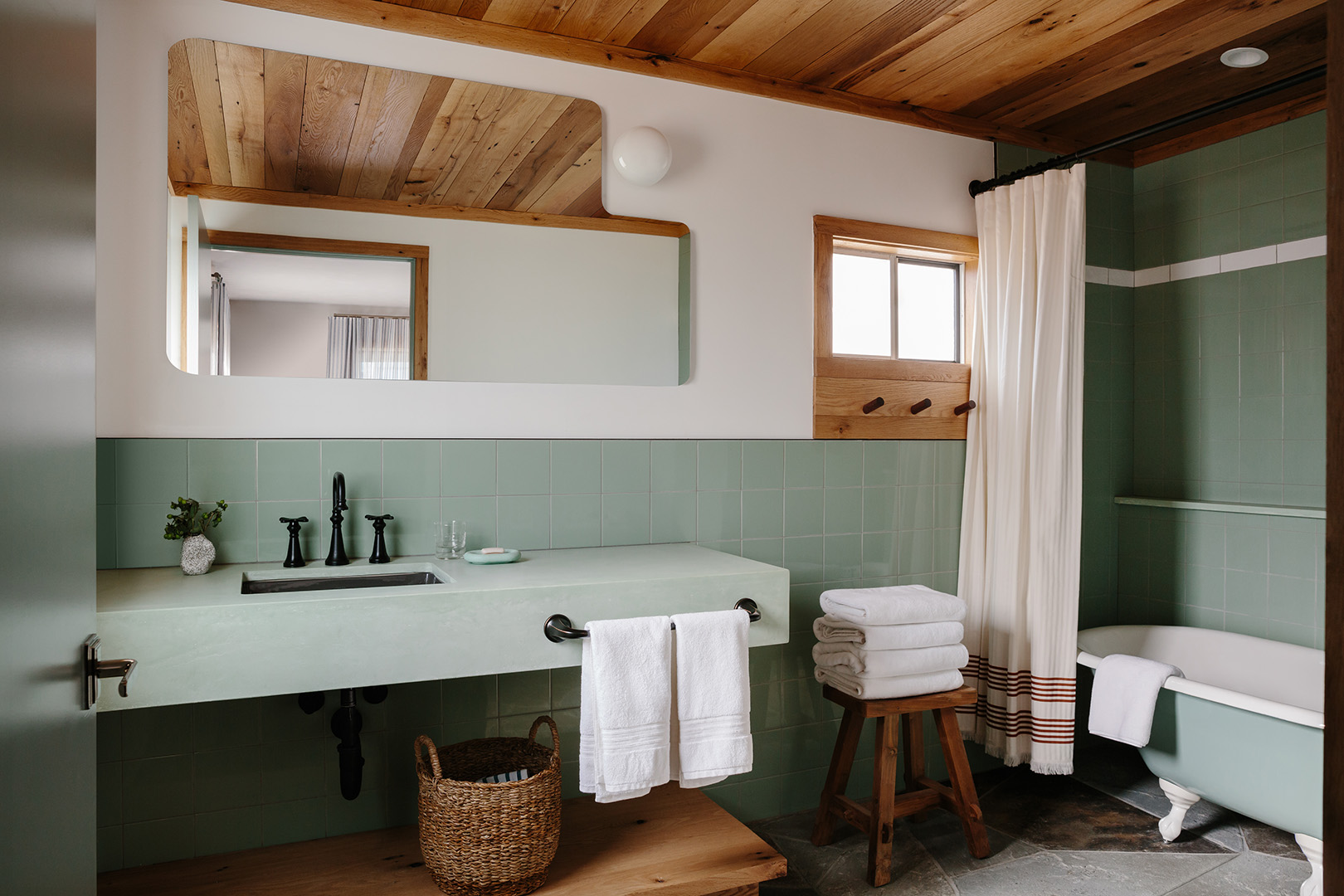 Sage green bathroom at motel