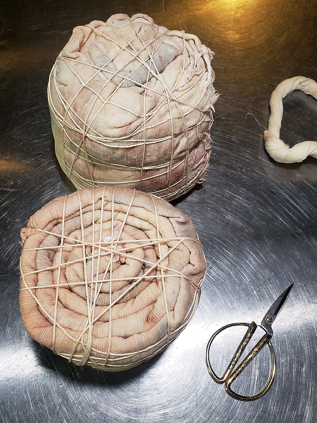 bundles of fabric tied with string