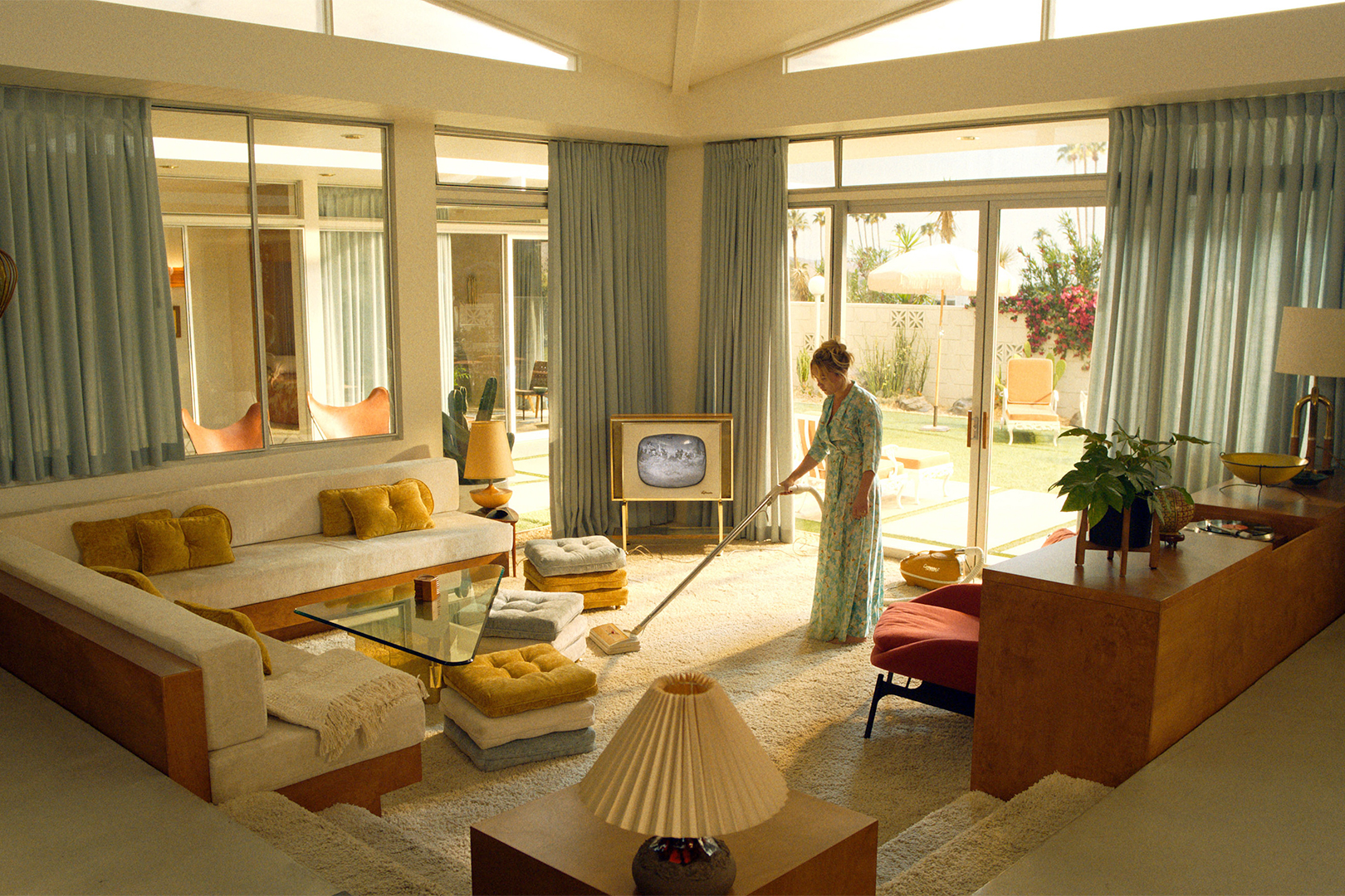 woman vacuuming floor.