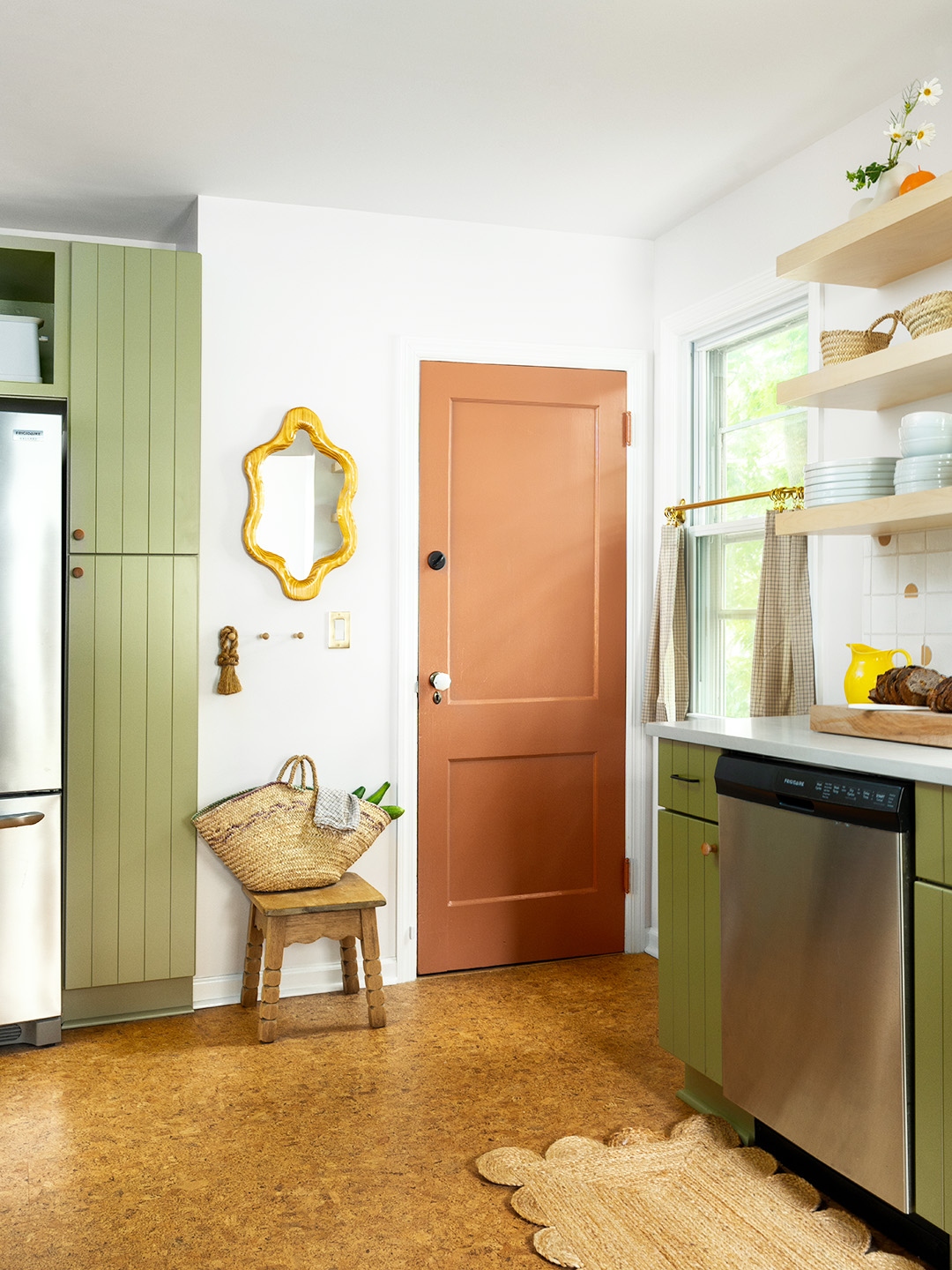 green kitchen with red door