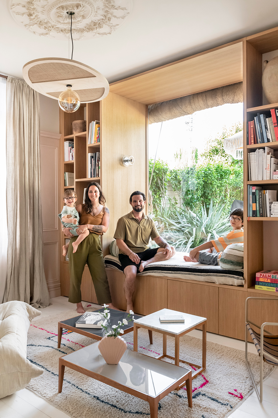 family sitting in window nook