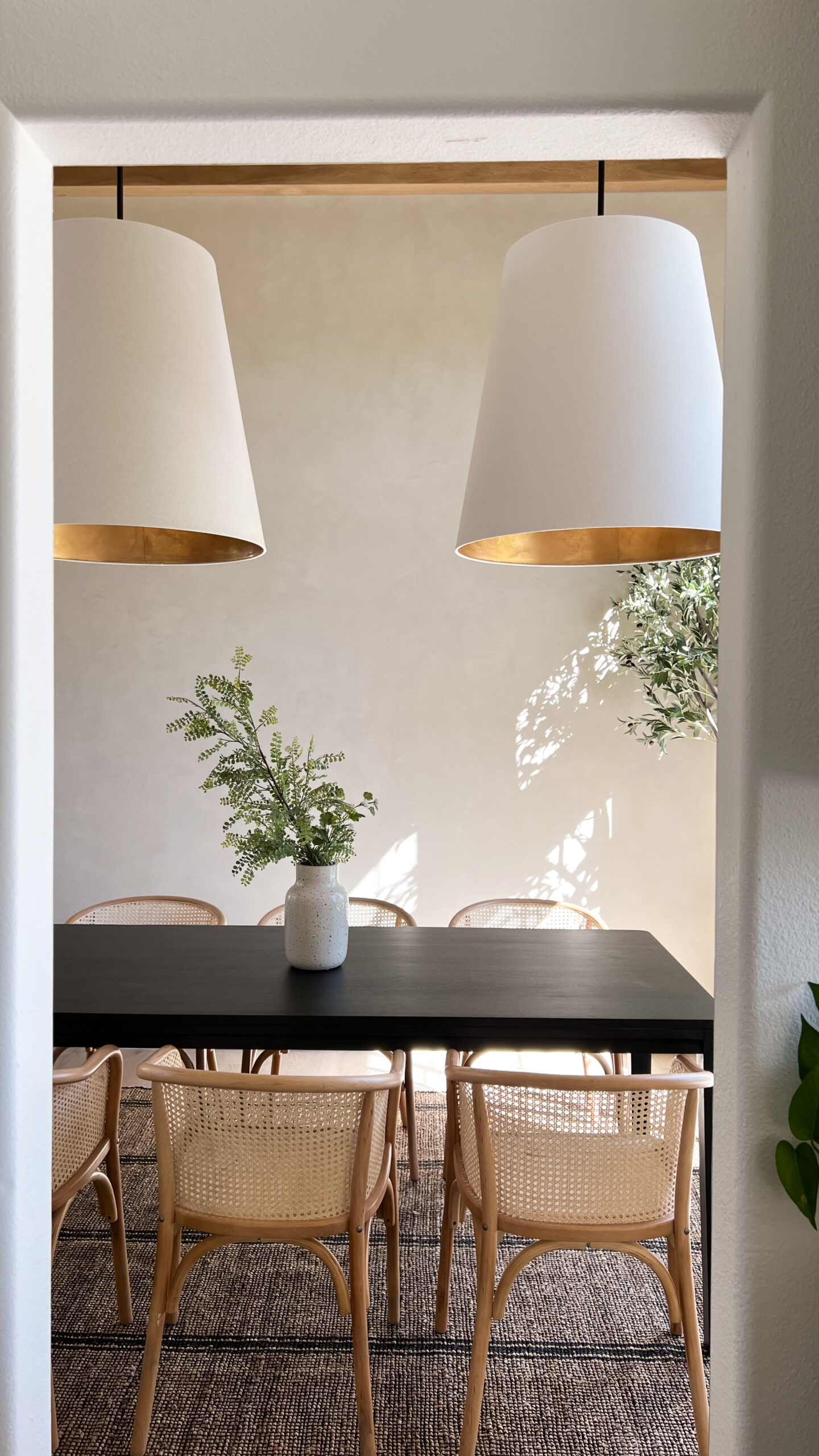 light reflecting on plaster wall in dining room