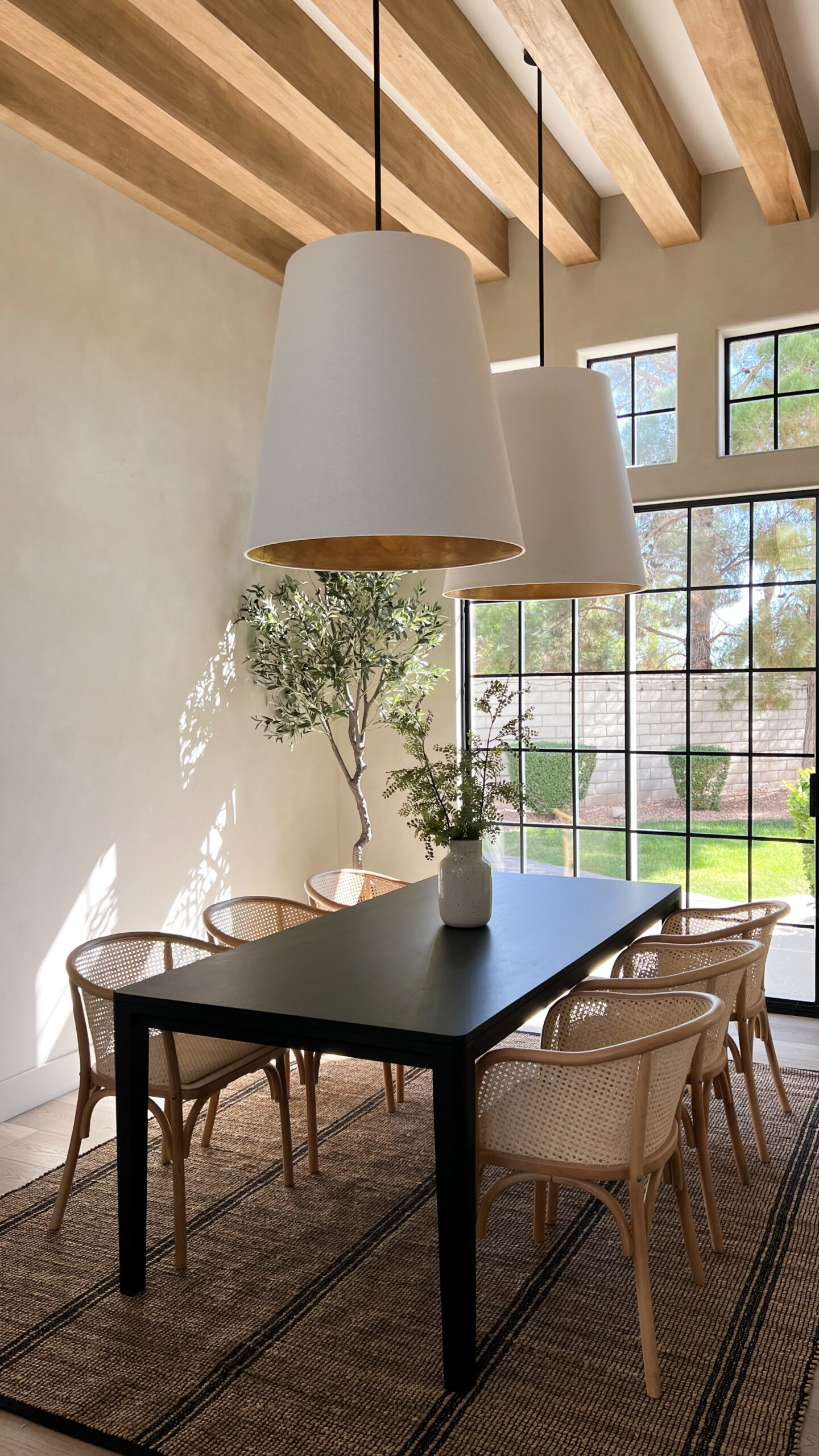 modern rustic dining room with striped jute rug