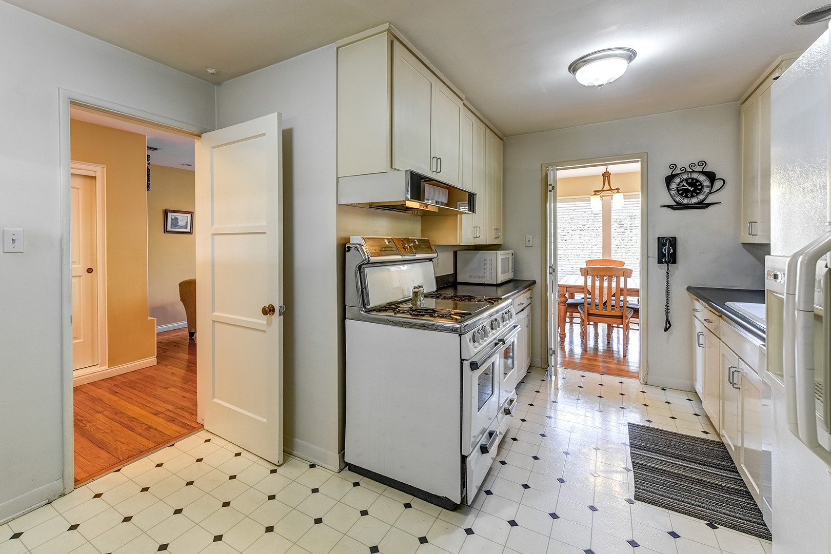 dated yellow closed off kitchen