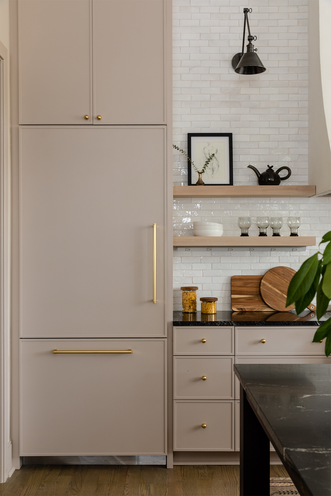 hidden refrigerator in pink kitchen