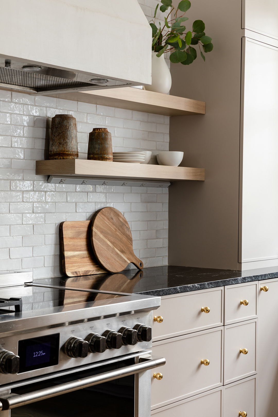 kitchen with pink cabinets and brass knobs