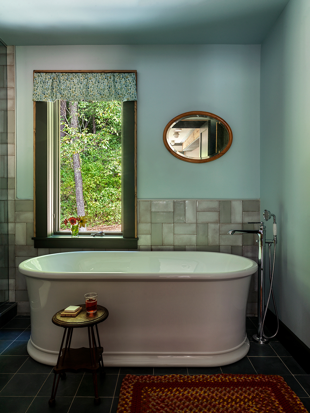 tub surrounded by tile