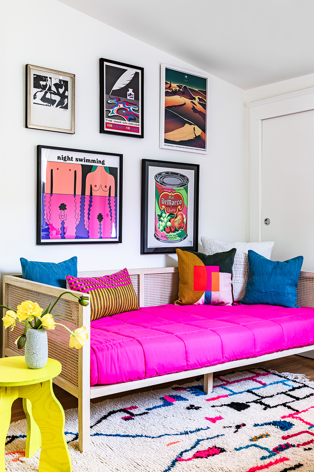 Guest room with bright pink comforter on day bed