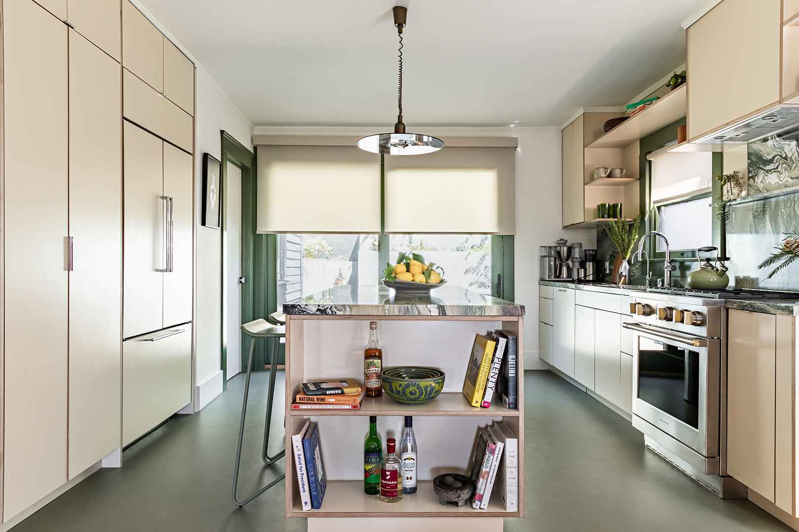 Kitchen island with cookbooks in shelves