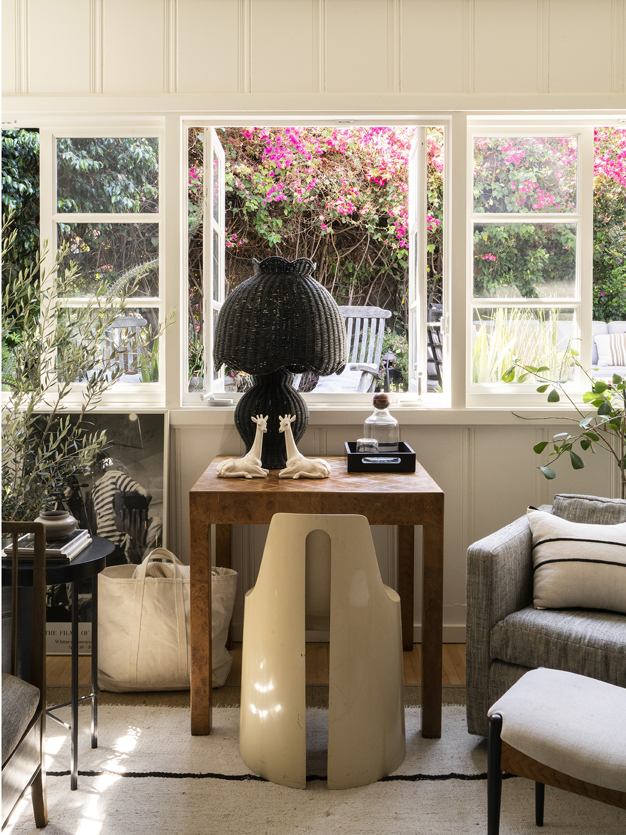 side table with lamp and collection of objects