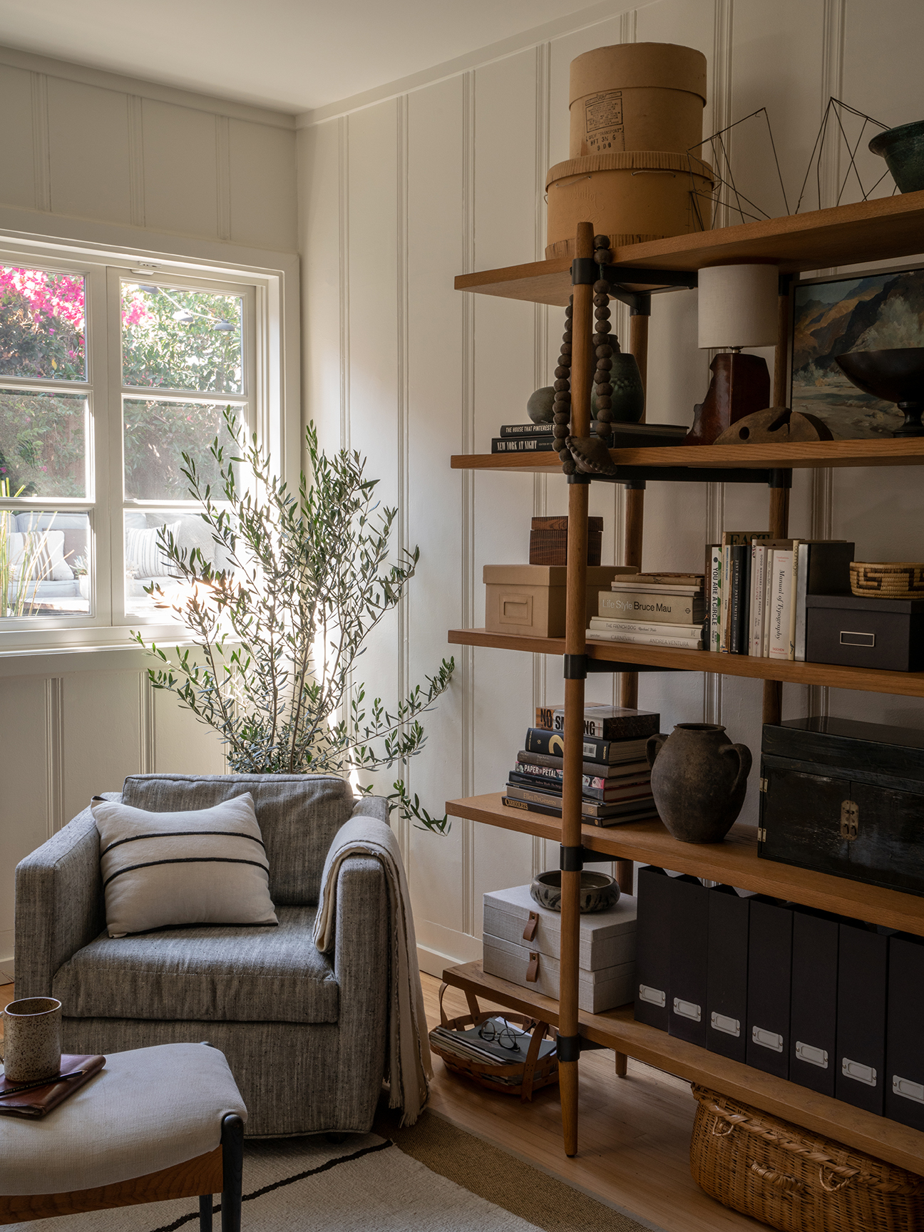 bookcase styled with lots of objects